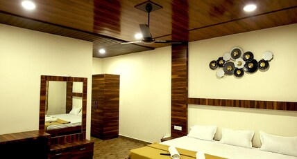 SURYAVAN HOLIDAYS Room Type - King Bed Room with Hill View
