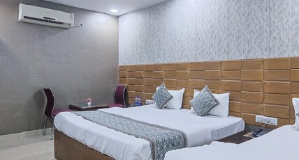 Hotel OM East Delhi Near Anand Vihar Railway Station Room Type - Deluxe Triple Room