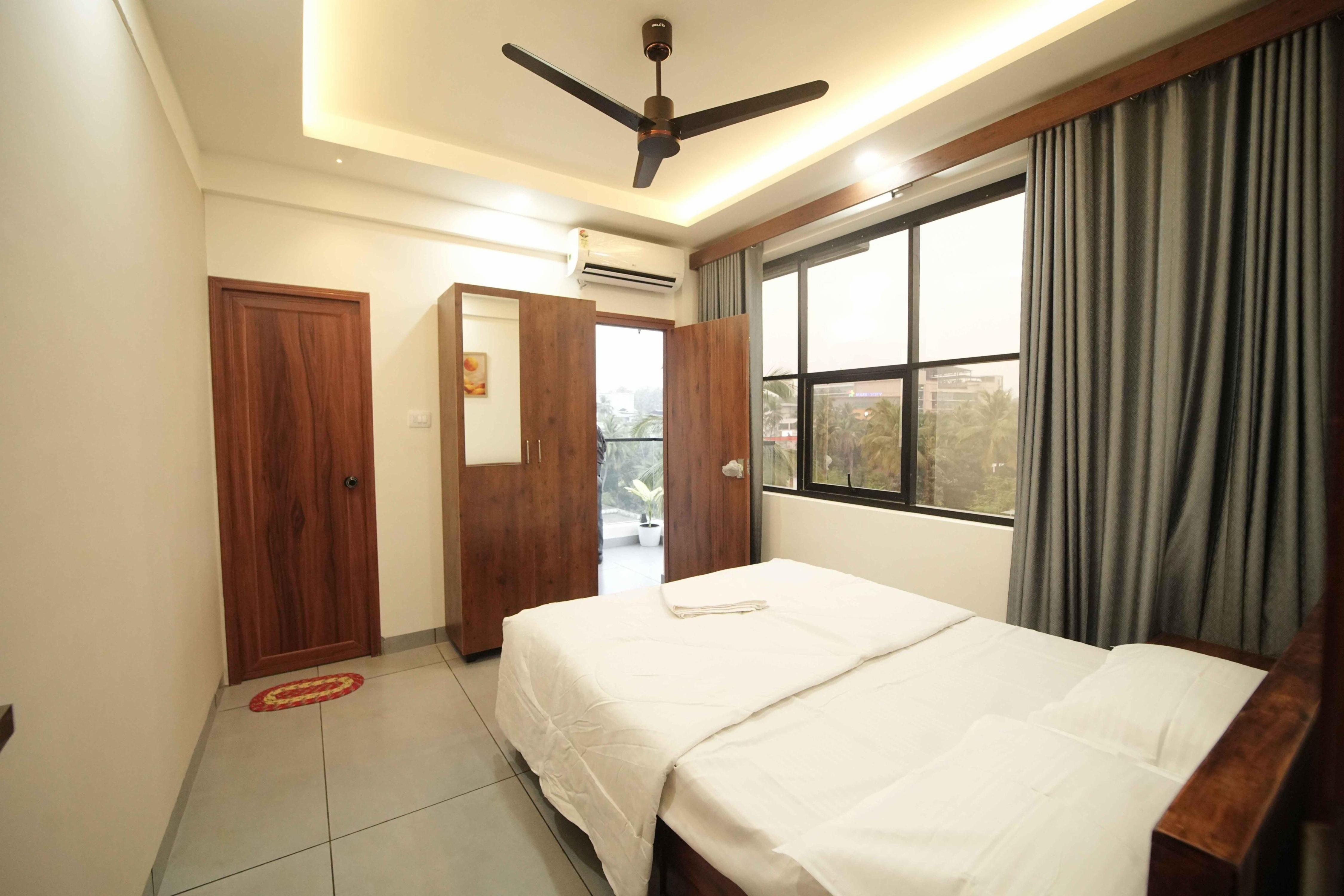 Spezio Room Type - City View Suite with King Bed and Balcony