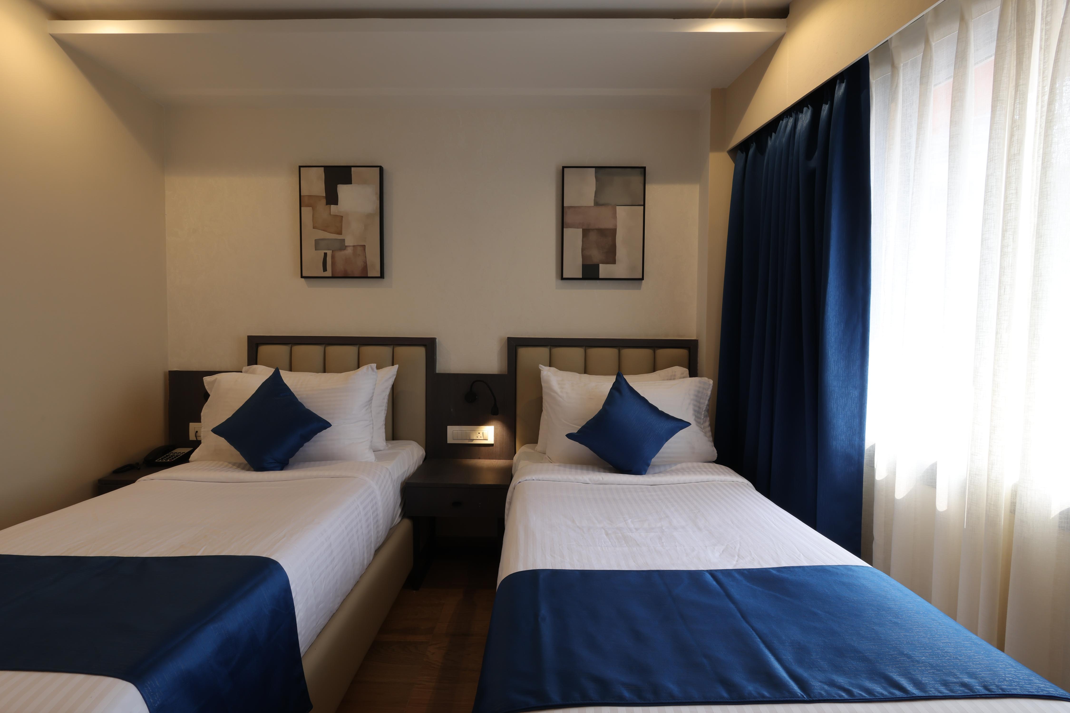 Grand Plaza Inn by RAK Rooms, Kannur - Tap to explore photos