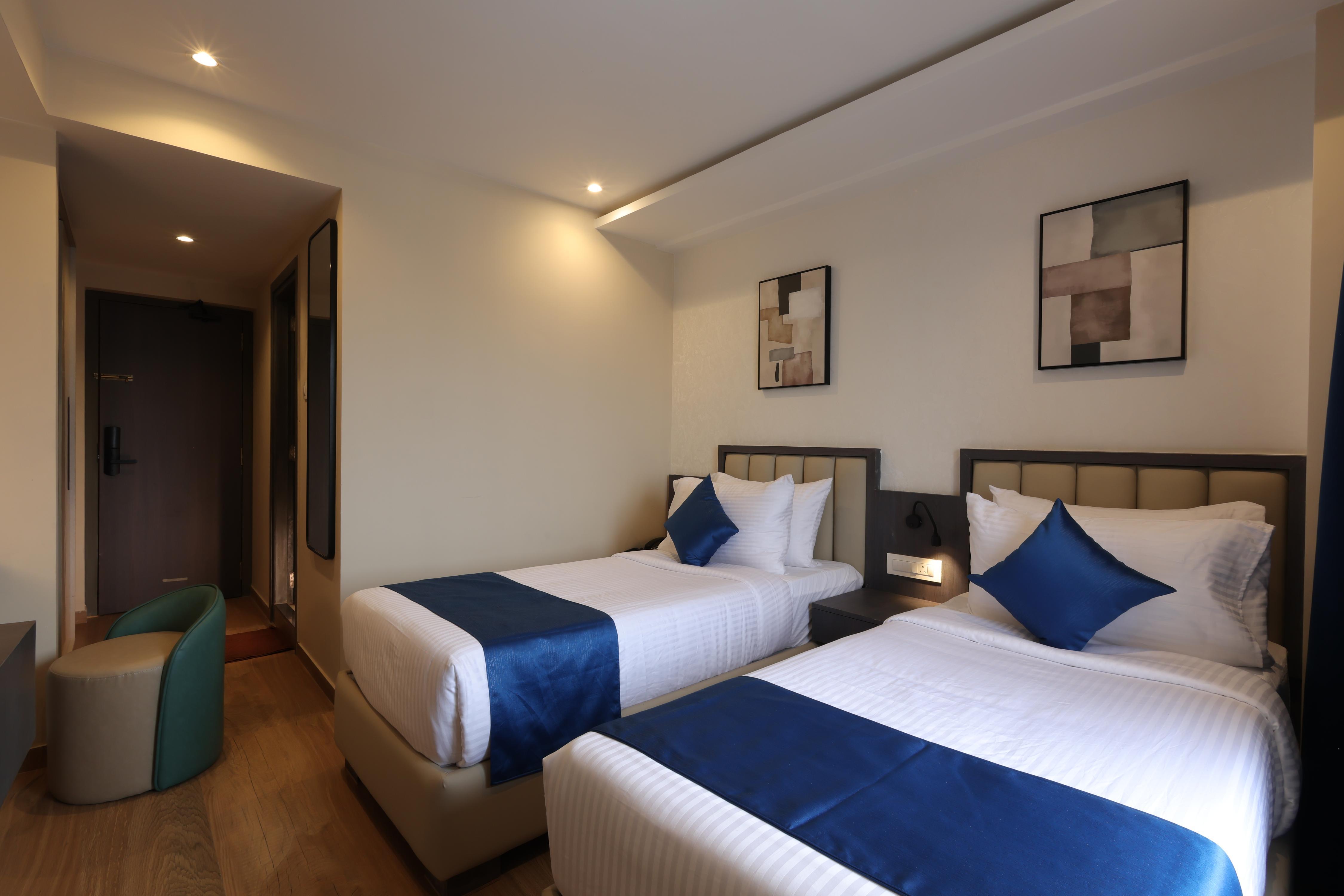 Grand Plaza Inn by RAK Rooms, Kannur - Tap to explore photos
