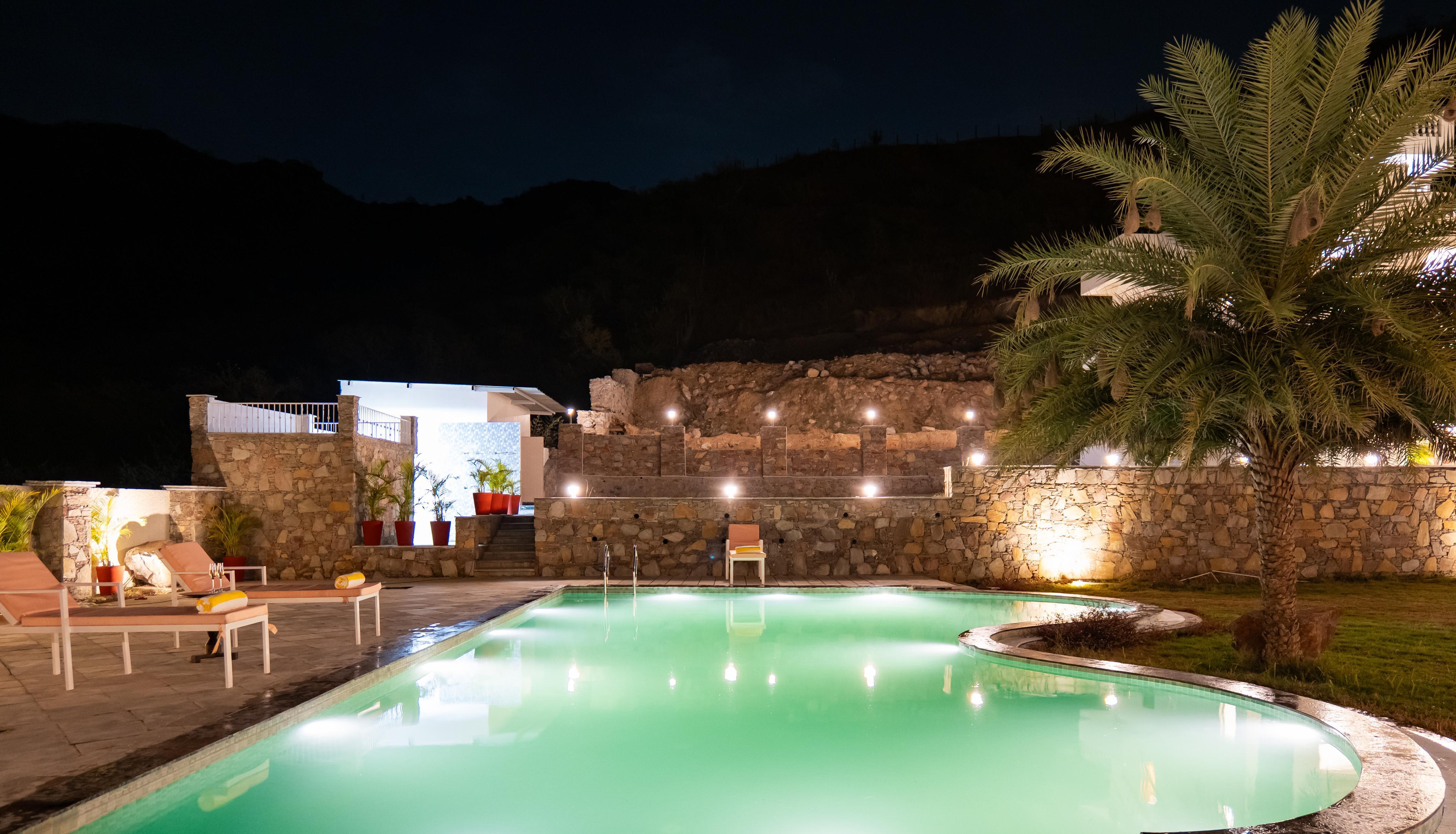 ELIVAAS Signature Mandovar 1 Room Suite with Common Pool & Garden - Tap to explore photos