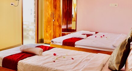 Sky View Guest House & Restaurant Room Type - AC DELUXE THREE BED BALCONY ROOM