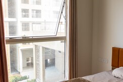 Spacious 2BHK Apartment in GIFT City for Families & Pros with Free Parking and pool