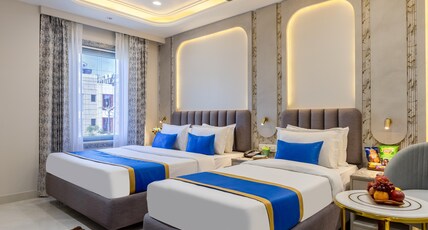Anu Plaza Luxury Living | Quiet Soundproof Rooms Near Connaught Place & New Delhi Railway Station Room Type - Twin Bed With City View