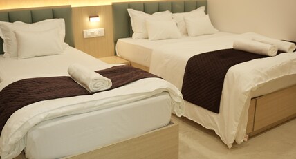 SAMYAK STAY Room Type - Deluxe Triple room ( Three person)