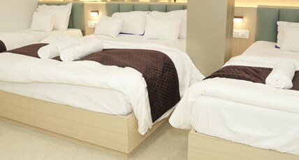 SAMYAK STAY Room Type - Family Room with One Double Bed and Two Single Beds