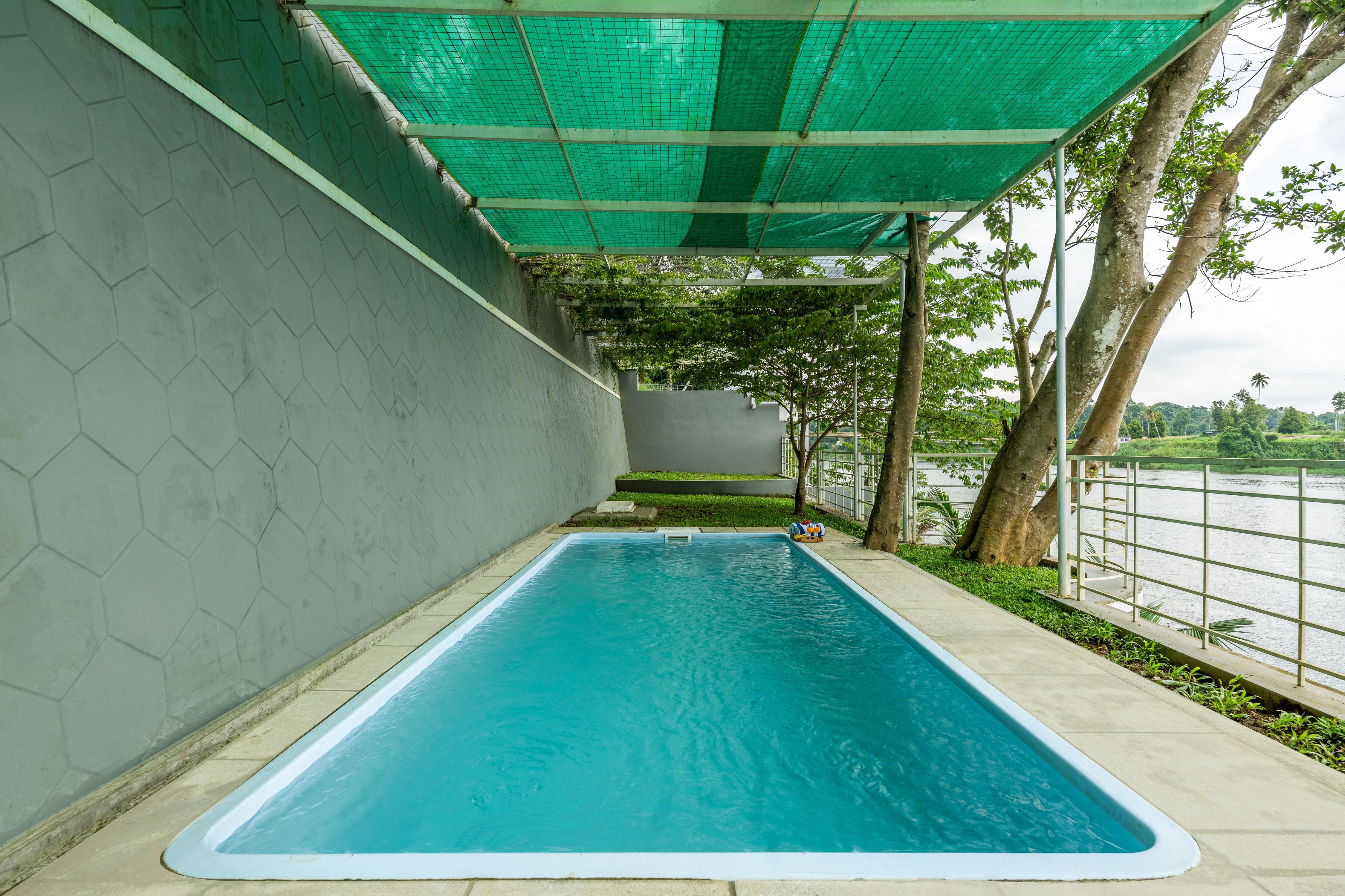 ELIVAAS Signature Vintage Retreat | 5 BHK Riverfront Heritage Villa - Tap to explore photos