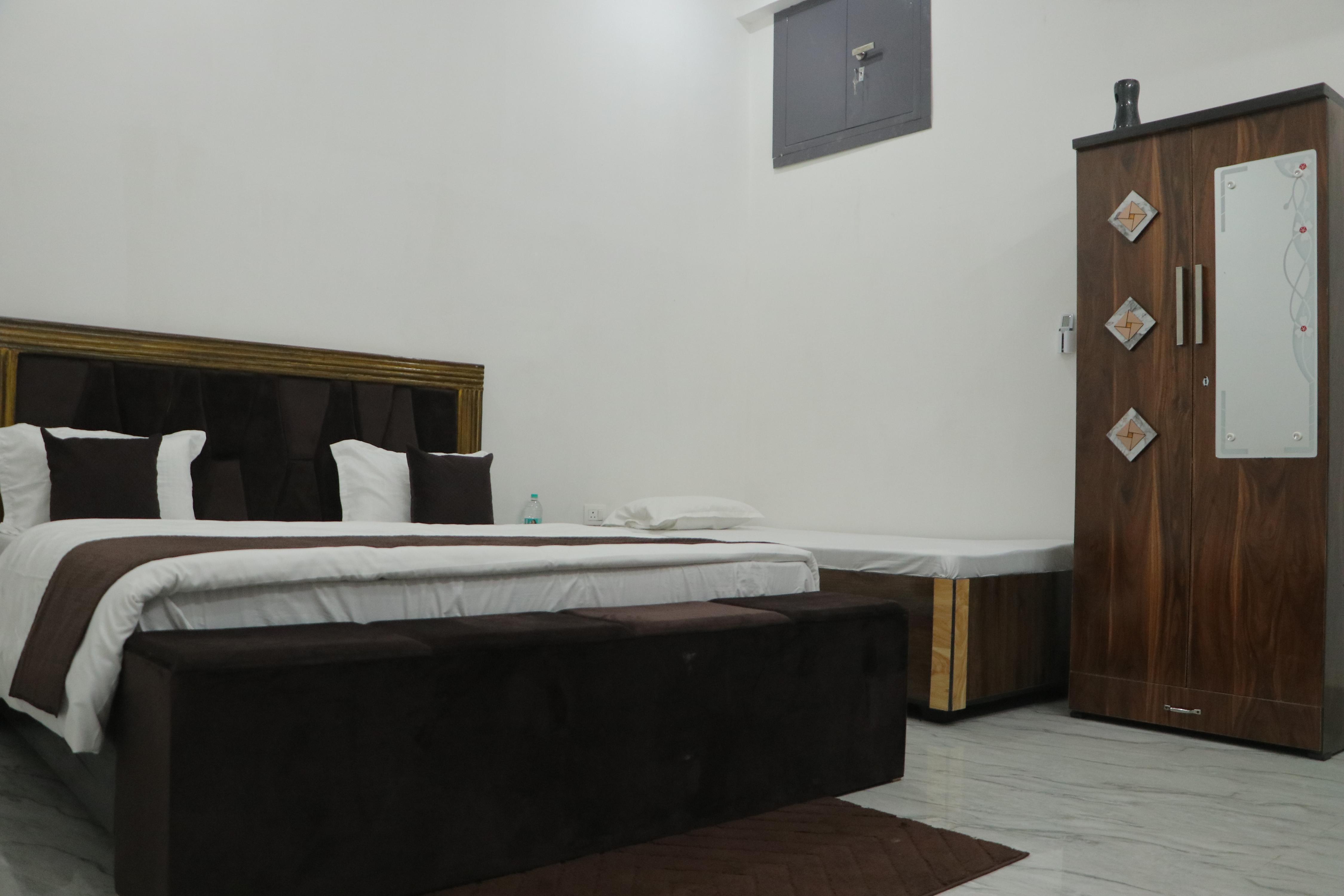HOTEL SANT KRIPA STAYS Room Type - SK Comfort Triple Bed Room