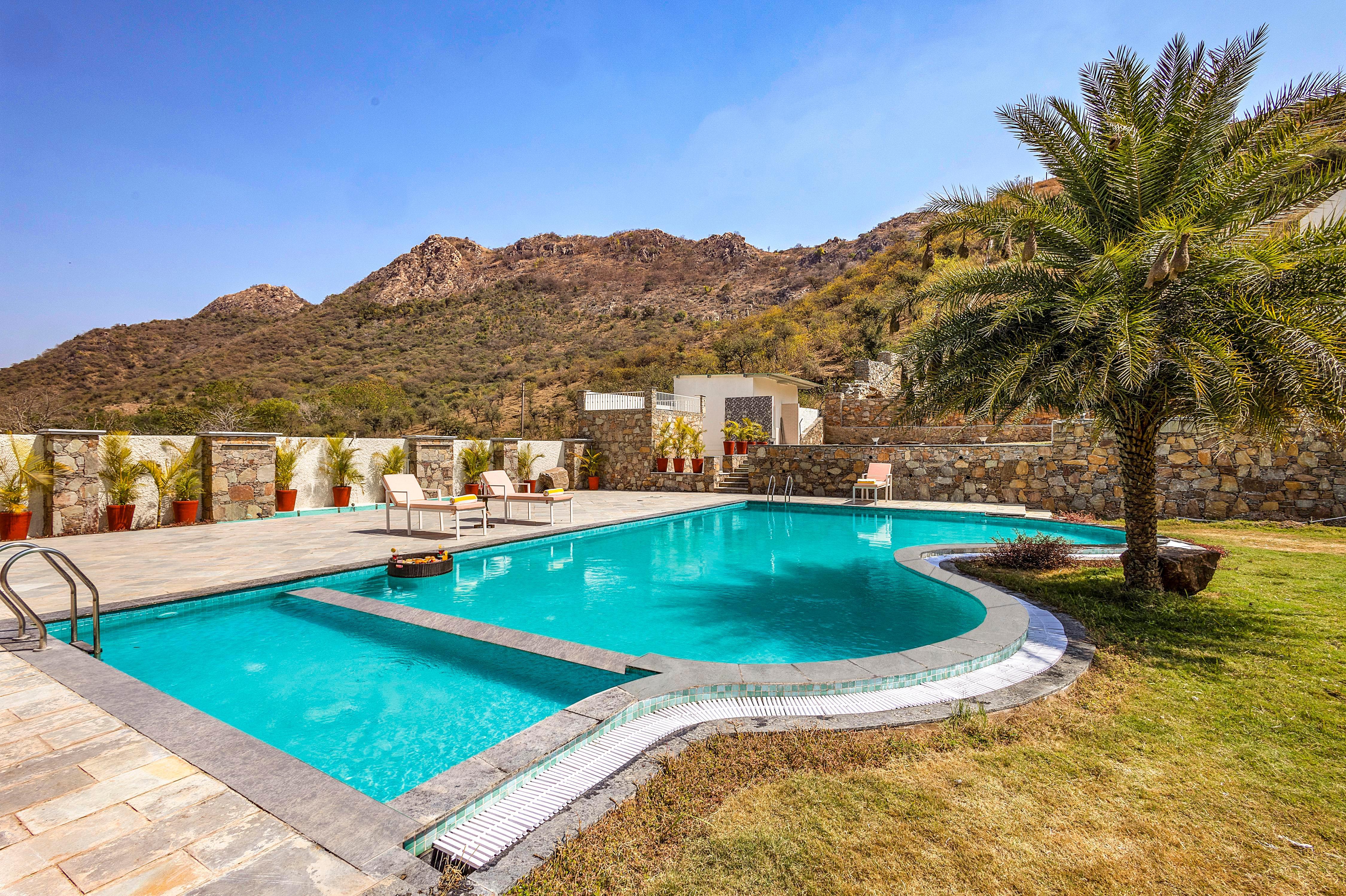 ELIVAAS Signature Mandovar 4 Room Suite with Common Pool & Garden - Tap to explore photos