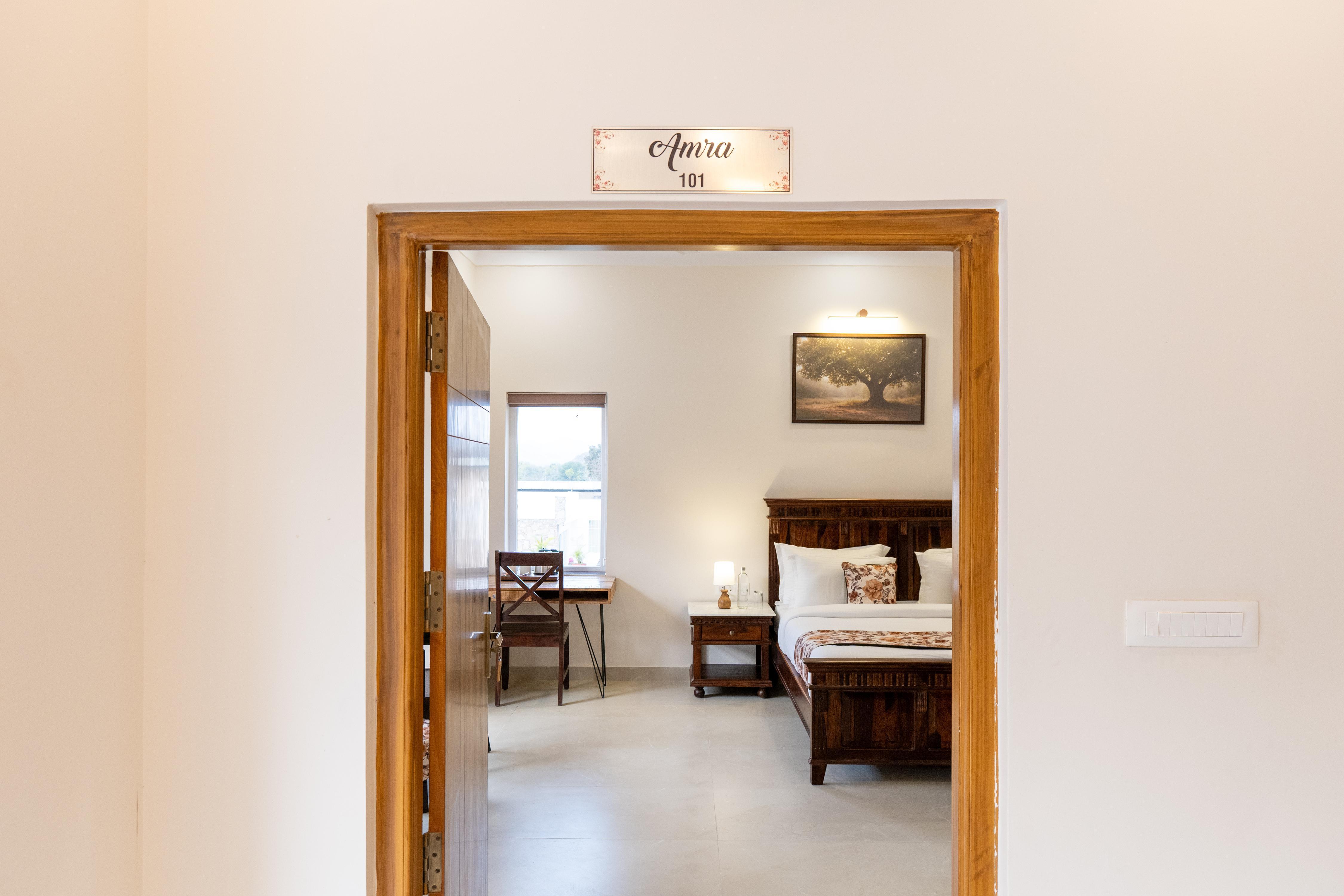 ELIVAAS Signature Mandovar 4 Room Suite with Common Pool & Garden - Tap to explore photos