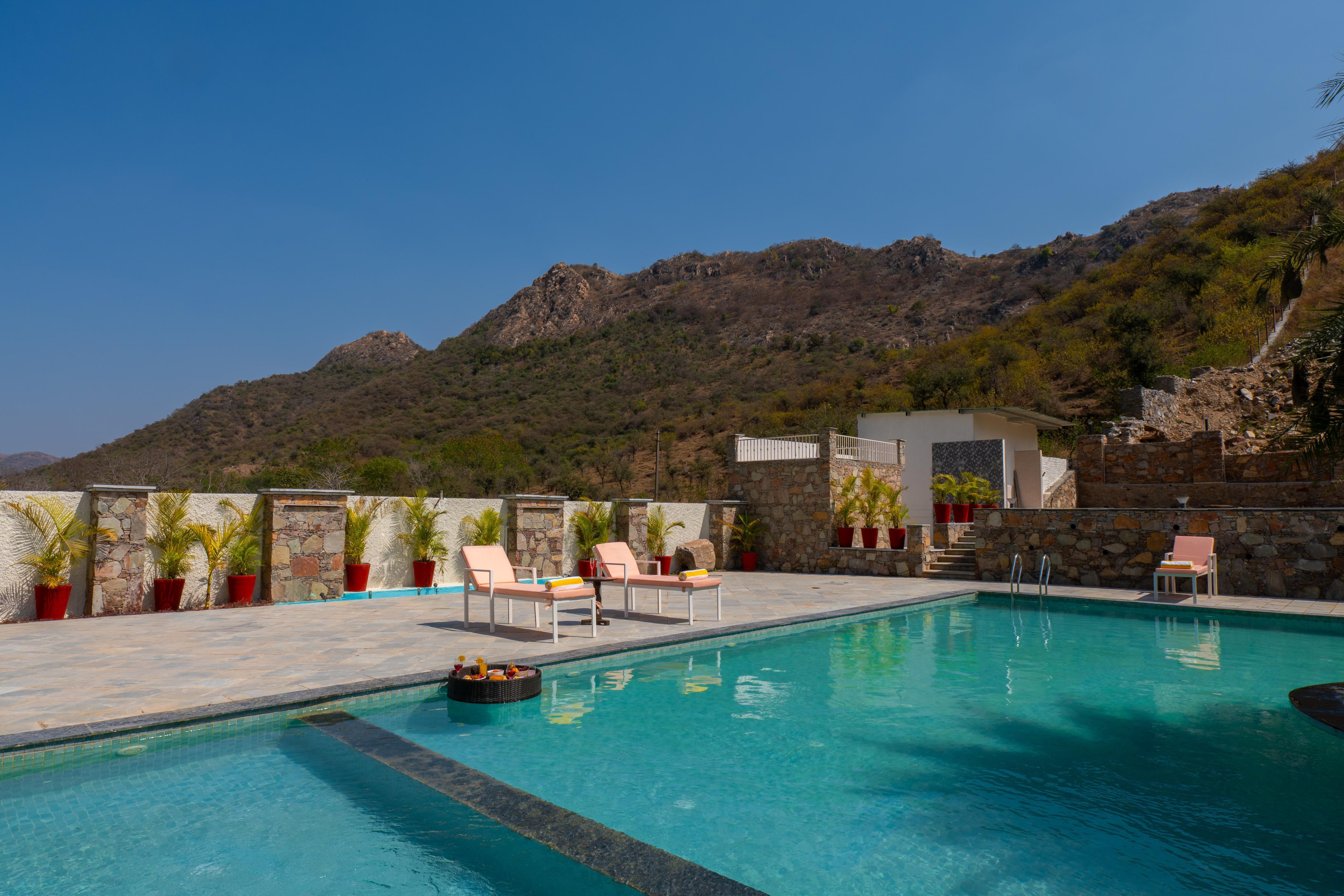 ELIVAAS Signature Mandovar 4 Room Suite with Common Pool & Garden - Tap to explore photos