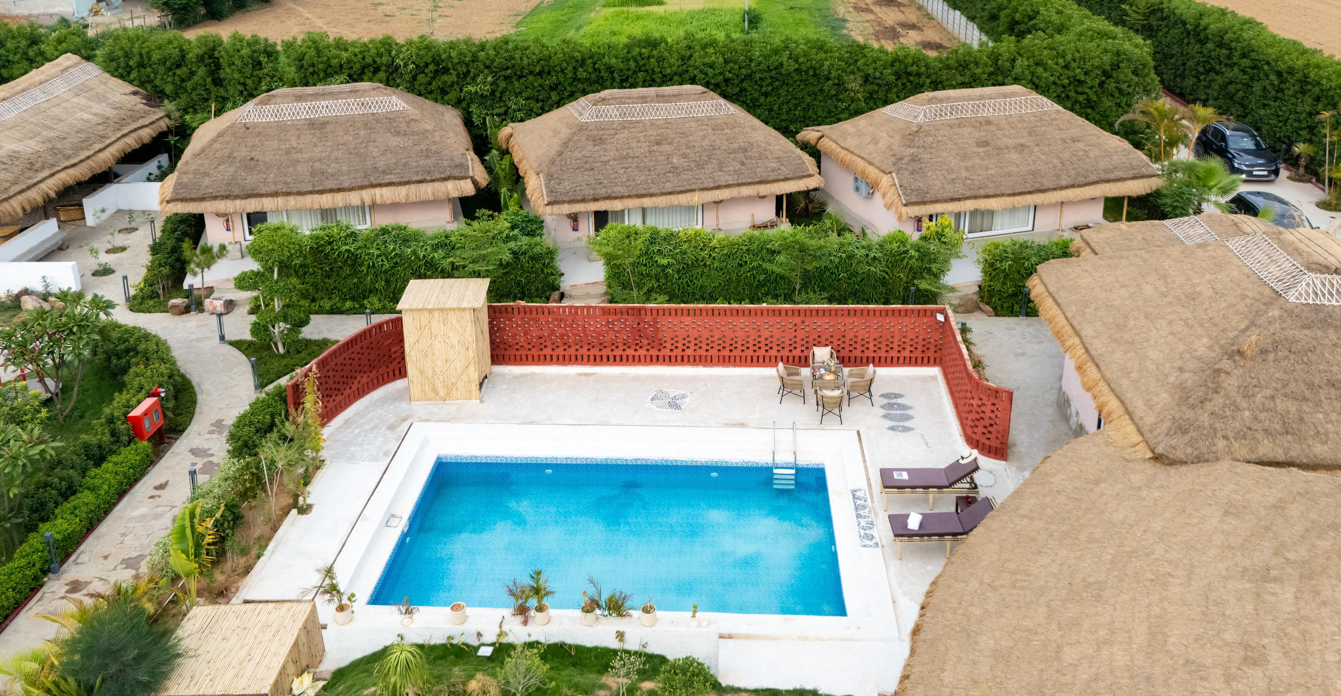 ELIVAAS Signature Kimaya | Suite With Shared Game Zone - Tap to explore photos