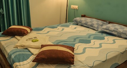 Greenfield Aura Stay Room Type - Bedroom 100