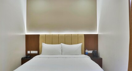 ARTHANA GRAND INN Room Type - Deluxe Room