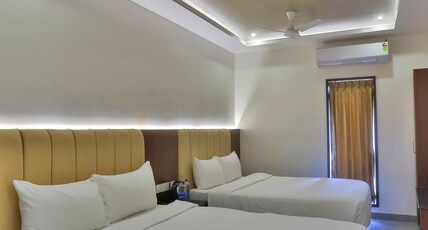 ARTHANA GRAND INN Room Type - Quad Deluxe Room