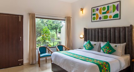 Treebo Blue River With Swimming Pool Room Type - Deluxe Room with Balcony
