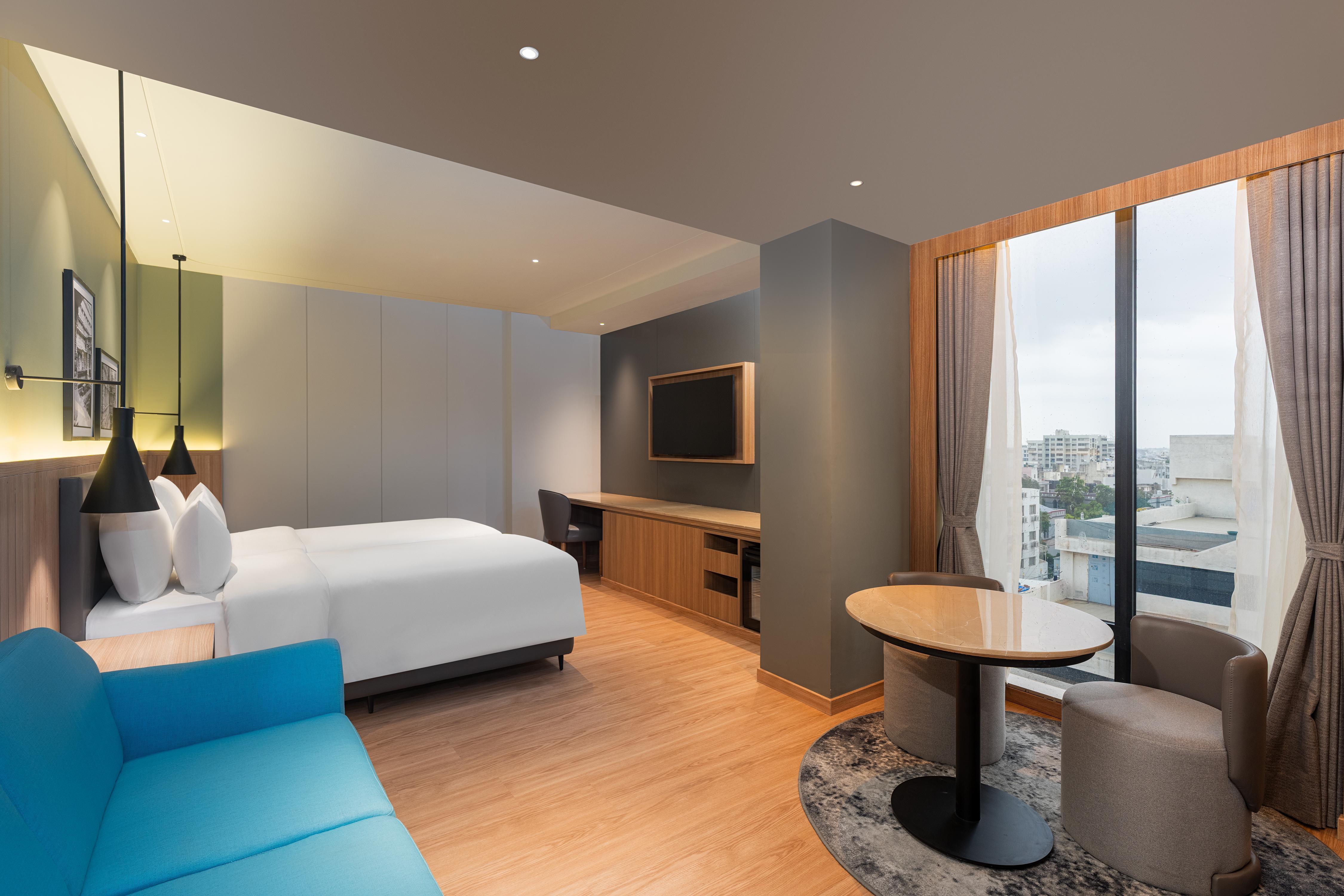 Park Inn & Suites by Radisson Rajkot - Tap to explore photos