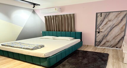 Indraprastha Airbnb & Homestay Room Type - Deluxe room with attached bathroom and balcony