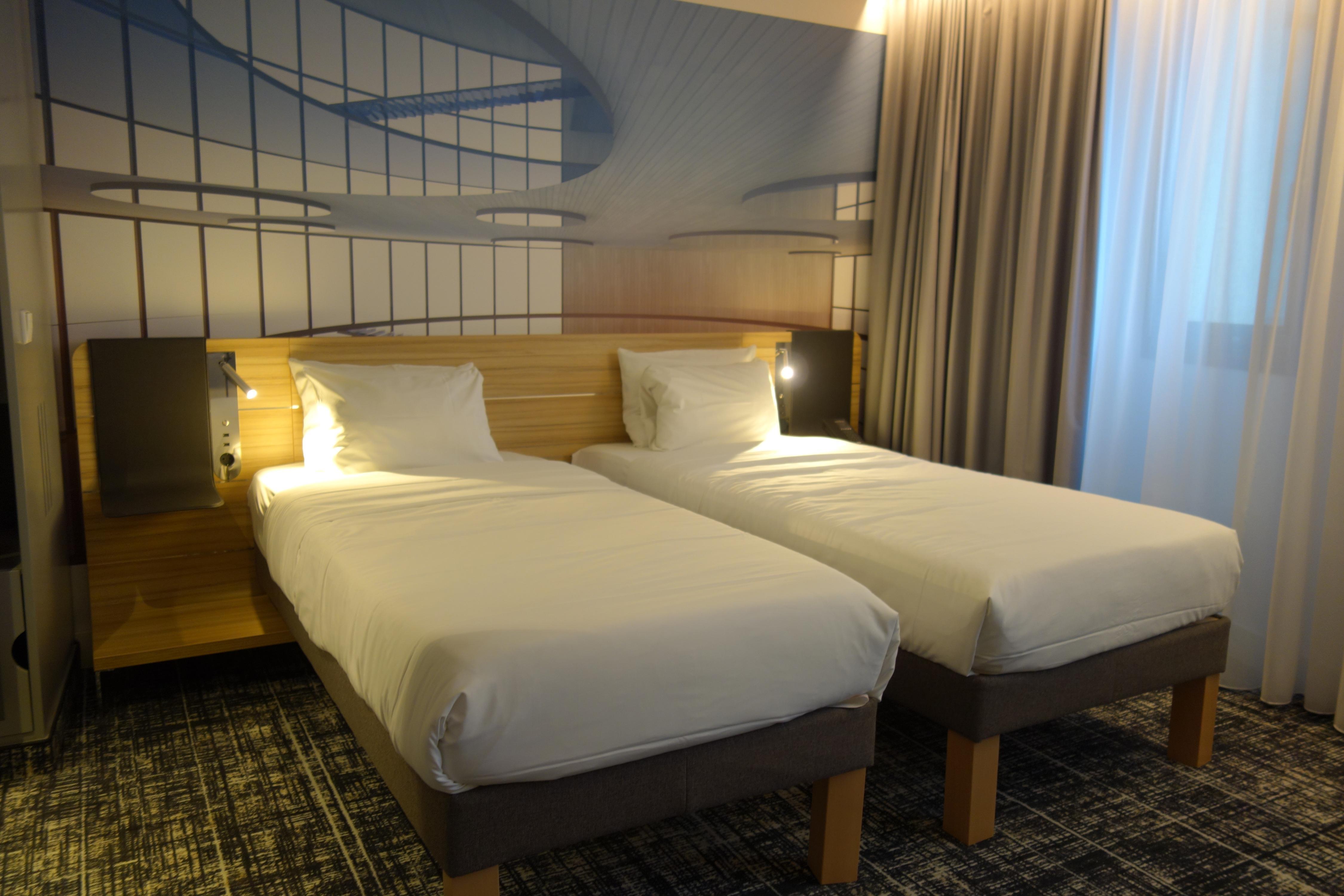 NOVOTEL SUITES BER POTSDAMER PL Room Type - Standard Suite with two single beds, a sofa bed, and a small kitchenette NOVOTEL SUITES BER POTSDAMER PL Room Type - Standard Suite with two single beds, a sofa bed, and a small kitchenette