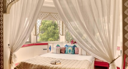 Sarang Palace - A Luxury Boutique Hotel Room Type - Mughal Heritage room with 180 degree city view with Designer bed Sarang Palace - A Luxury Boutique Hotel Room Type - Mughal Heritage room with 180 degree city view with Designer bed