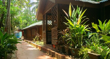 Palm Grove Eco Resort Room Type - Canal Family Ac Room Rate for 3 pax Palm Grove Eco Resort Room Type - Canal Family Ac Room Rate for 3 pax