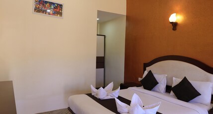 King Garden Resort (Pure Veg) Room Type - Princess Room with Sitout King Garden Resort (Pure Veg) Room Type - Princess Room with Sitout