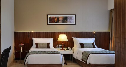 Residency Sarovar Portico Room Type - Deluxe Room - Twin Bed