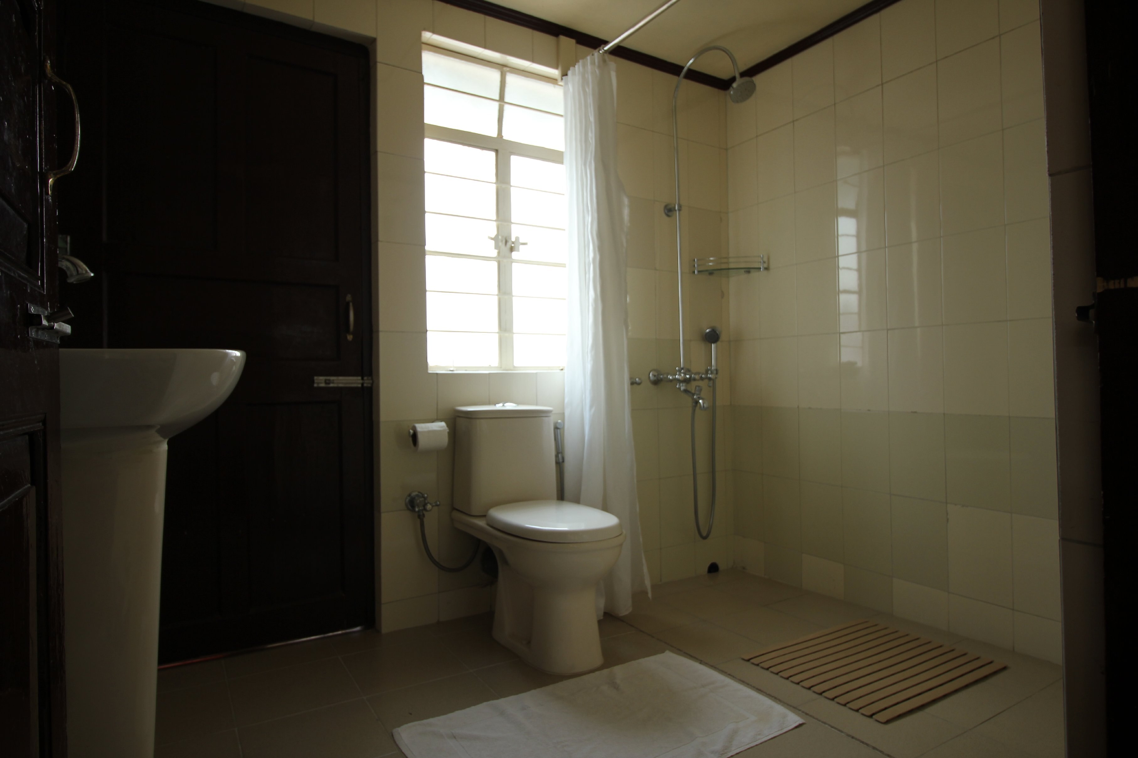 The Shillong Bed and Breakfast | Room & Caretaker - Tap to explore photos