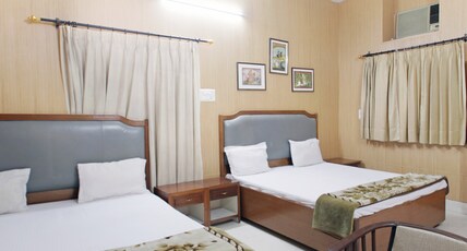 Tourist Guest House Room Type - Four Beds AC Room