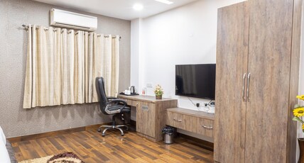 Red Castle Hotel near BLK Hospital. Room Type - Queen Suite with Work Desk and Smart TV