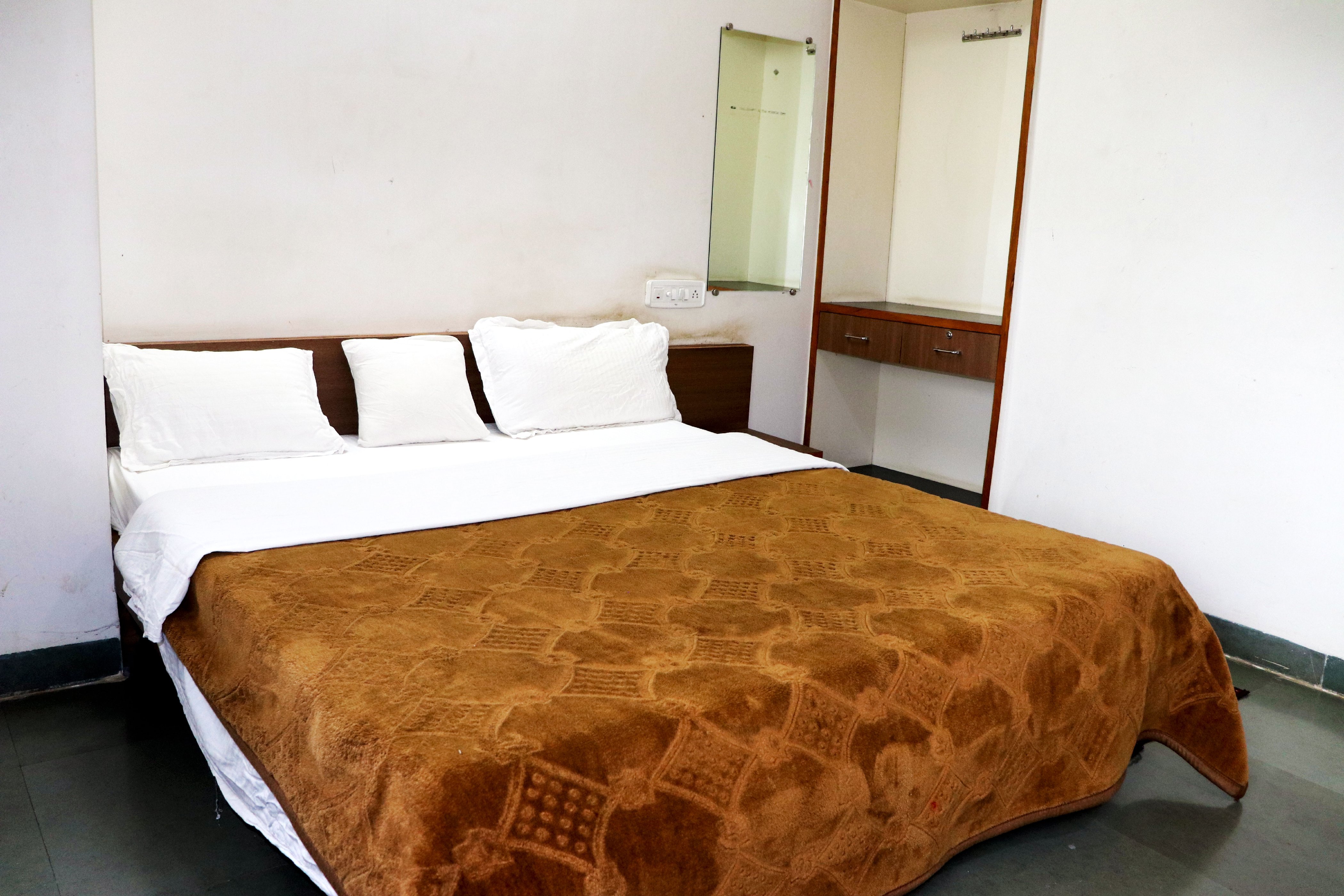 Hotel Devarshi  - Tap to explore photos