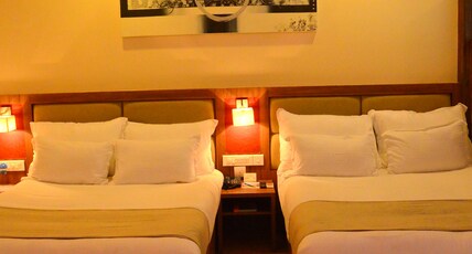 Pramod Convention & Beach Resort Room Type - Family Executive Suite (Pool View) with Private Balcony
