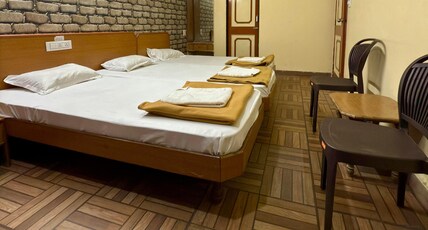 HOTEL MADHURAM Room Type - 3 Bedded Family AC Room