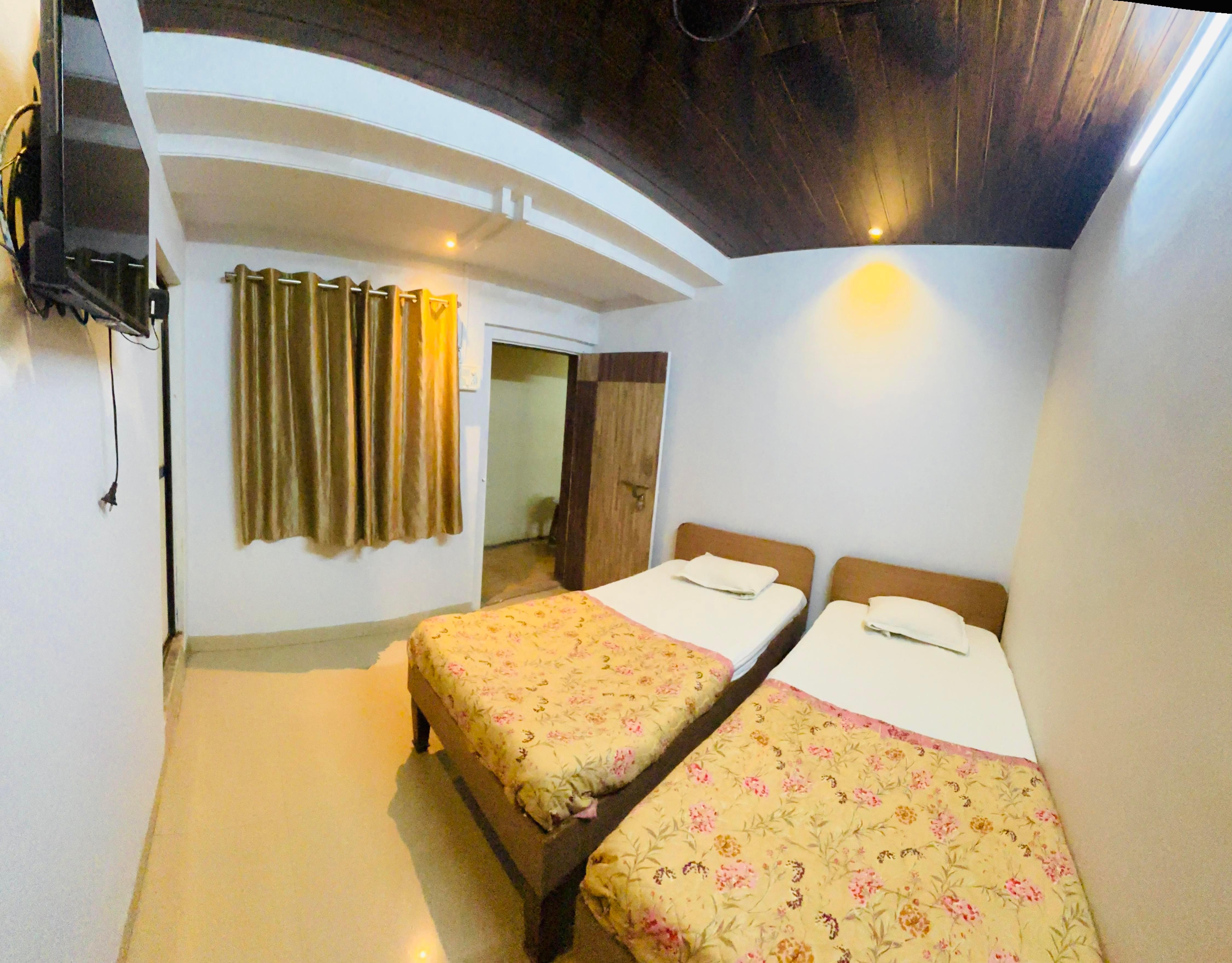 HOTEL ASHIRWAD LODGING Room Type - DELUXE Room (NON AC )