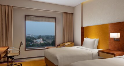 Courtyard by Marriott Raipur Room Type - Premier Twin 2 Single Beds Pool View Room Courtyard by Marriott Raipur Room Type - Premier Twin 2 Single Beds Pool View Room