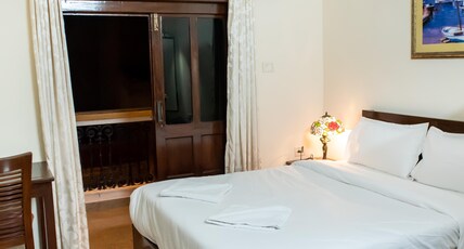 Maitri Guest House Room Type - Deluxe Room