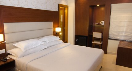 Hotel Aura Room Type - Deluxe Room AC with free WiFi