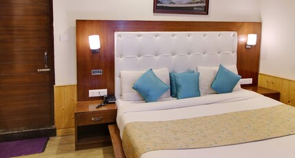 Holiday Heaven -Pure veg Hotel Walking to Mall Road Room Type - Deluxe Room