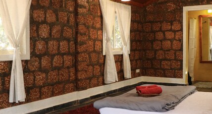 Namaste Jungle - A Boutique Homestay Room Type - Wooden AC Cottage with Garden View
