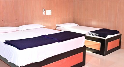 Sreeniketanam Lodge Room Type - Deluxe Three Bed Ac Room (Check-in 8 AM, Check-out 6 AM) Sreeniketanam Lodge Room Type - Deluxe Three Bed Ac Room (Check-in 8 AM, Check-out 6 AM)