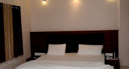 SHREE HOTEL Room Type - 4 Bedded AC Family Room (Price is of 4 Adults)
