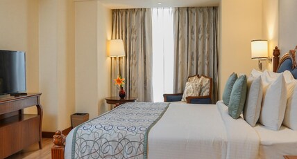 Golden Sarovar Portico Room Type - Presidential Suite with Living Room and Dining Area Golden Sarovar Portico Room Type - Presidential Suite with Living Room and Dining Area