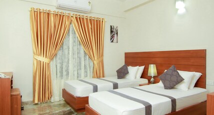 Orionis Kannur Room Type - Deluxe Double AC Room