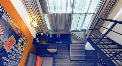 MERCURE SINGAPORE BUGIS Room Type - Executive Loft Room with Queen Bed and Sofa MERCURE SINGAPORE BUGIS Room Type - Executive Loft Room with Queen Bed and Sofa