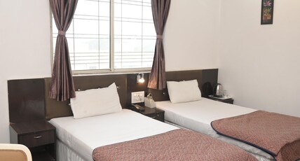 ASIAN INTERNATIONAL HOTEL Room Type - DELUXE ROOM Non AC