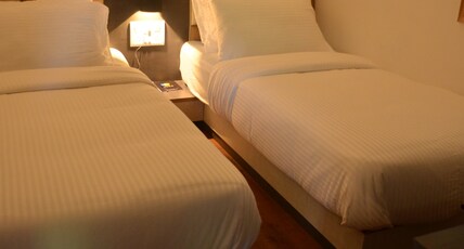 Aura Room Type - Deluxe Twin Bed Room non ac