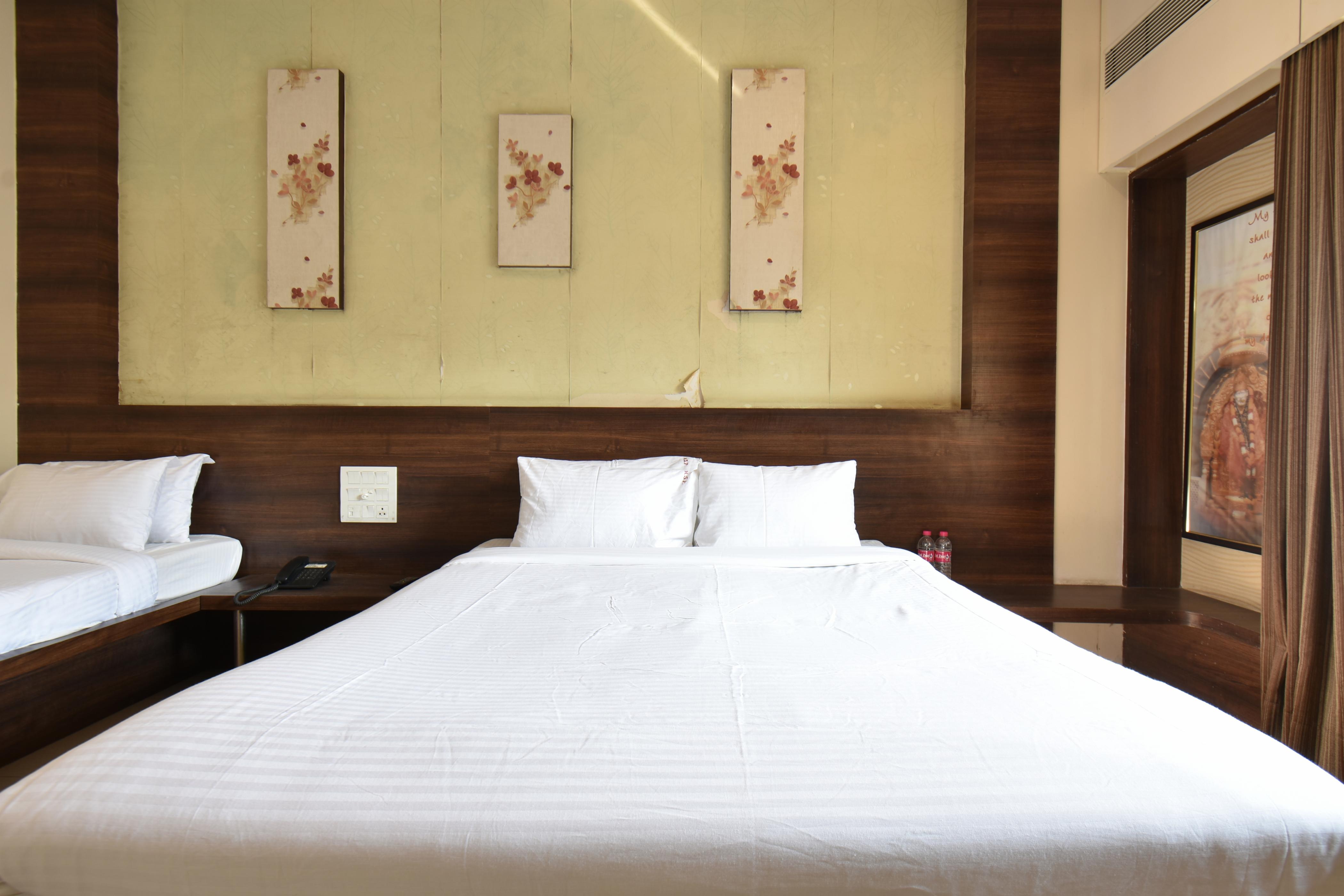 Hotel Sai Sparsh (Newly Renovated) - 150 Meters from Saibaba Temple - Tap to explore photos
