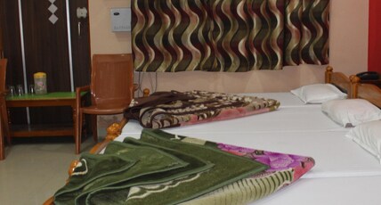 hotel raj & restaurants Room Type - Four Beded Deluxe Room