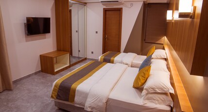 Kuredhi Beach Inn Room Type - DELUXE FAMILY ROOM WITH BALCONY Kuredhi Beach Inn Room Type - DELUXE FAMILY ROOM WITH BALCONY